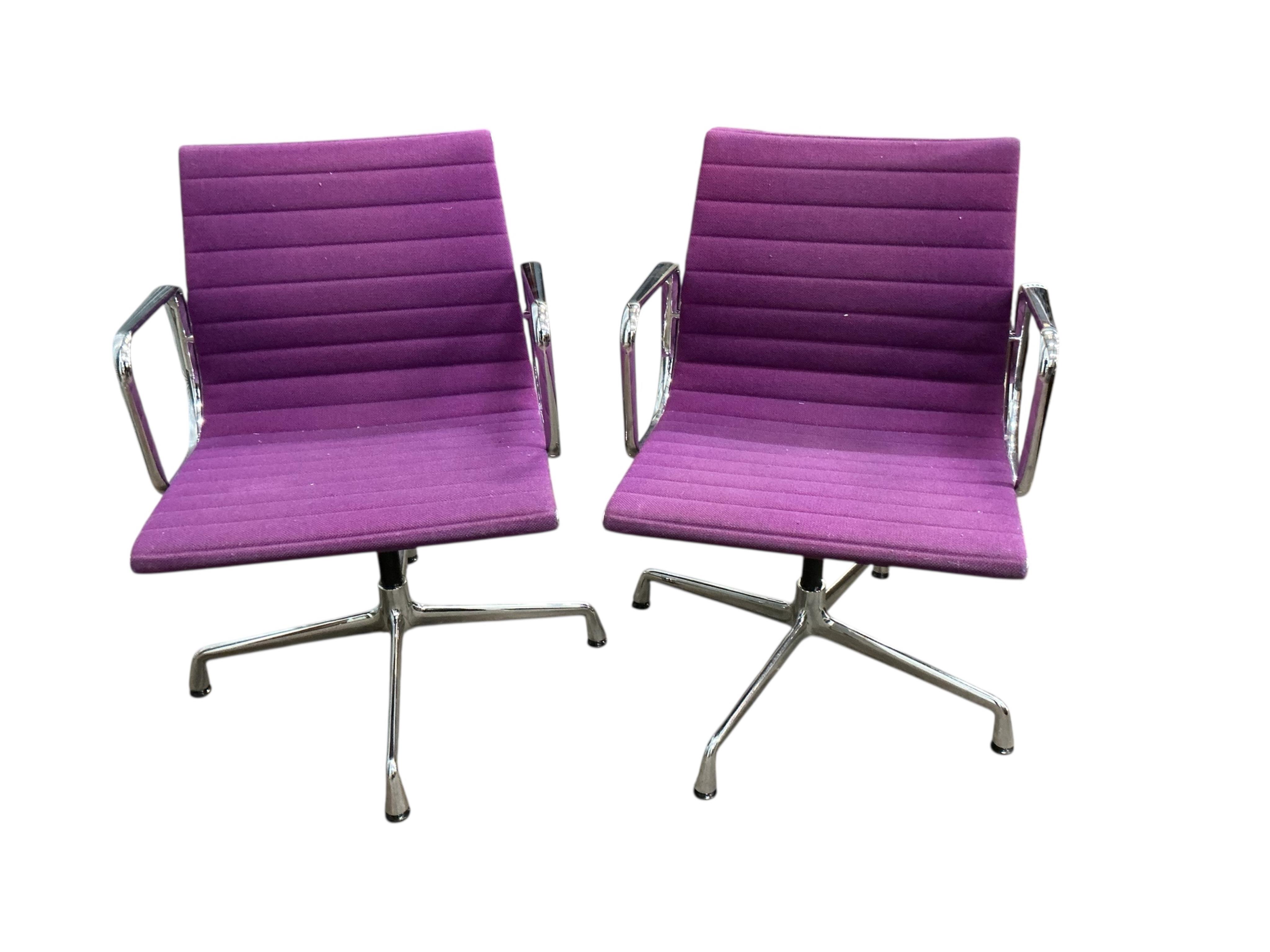 Charles Eames for Vitra, a pair of chrome swivel desk chairs on four prong bases, width 57cm, depth 50cm, height 82cm